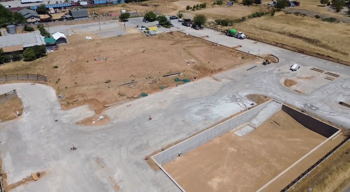Completed grading and the stormwater retention pond, April 2025